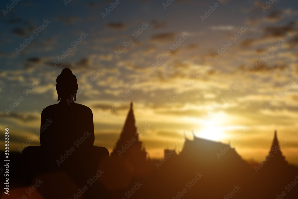 Silhouette of Buddha on golden temple sunset background. Travel attraction in Thailand. Silhouette of Buddha on golden temple sunset background. Travel attraction in Thailand.