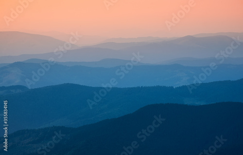 Mountain valley during sunrise. Sun shine in the morning. Natural landscape at the summer time. View from high mountains. Travel image © biletskiyevgeniy.com