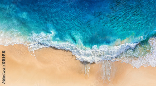 Fotografie, Obraz Beach and waves as a background from top view