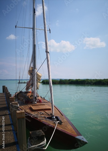 Fototapeta Naklejka Na Ścianę i Meble -  Graceful Sailboat in the Harbor