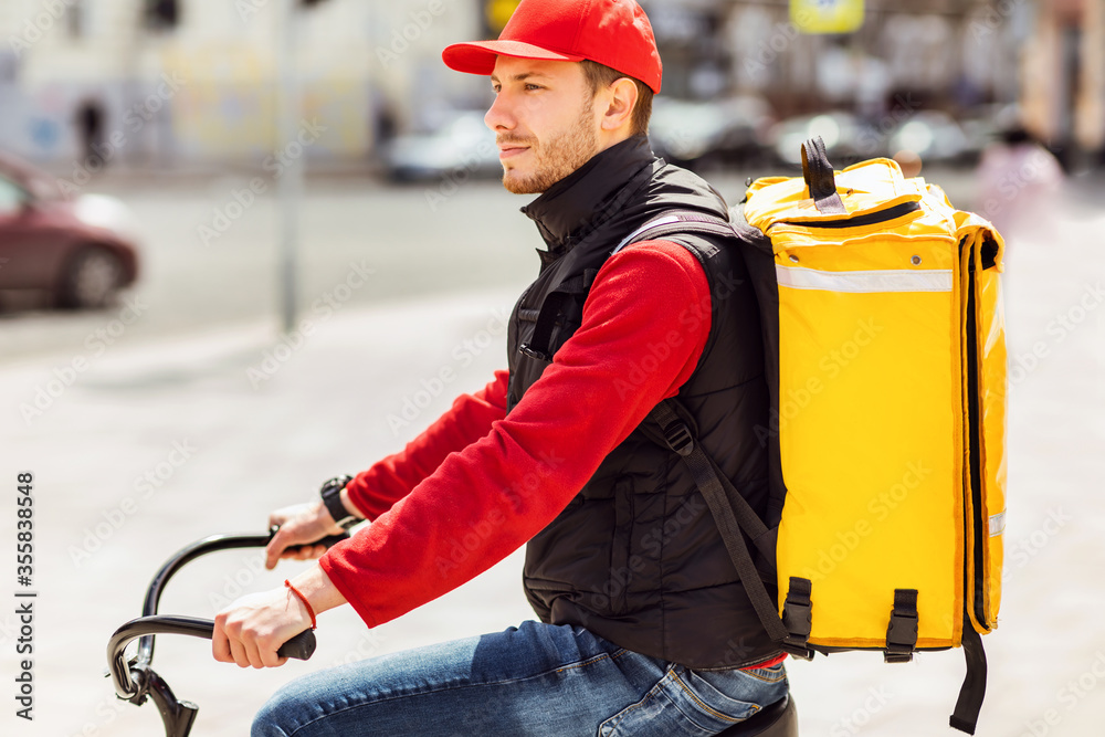 Courier Guy Riding Bike Delivering Meals In City Outdoors Courier Guy Riding Bike Delivering Meals In City Outdoors