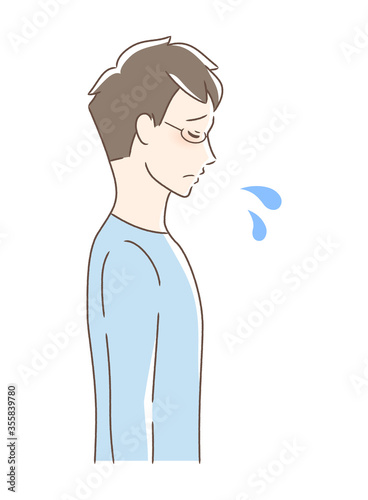 悲しむ男性の横顔