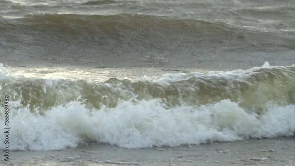 Slow motion waves with texture and wind spray, raw natural wonders Slow motion waves with texture and wind spray, raw natural wonders