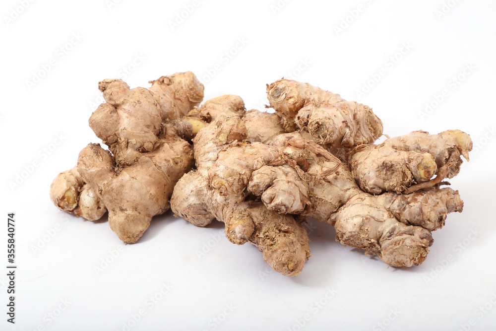 Fresh ginger root or rhizome isolated on white background