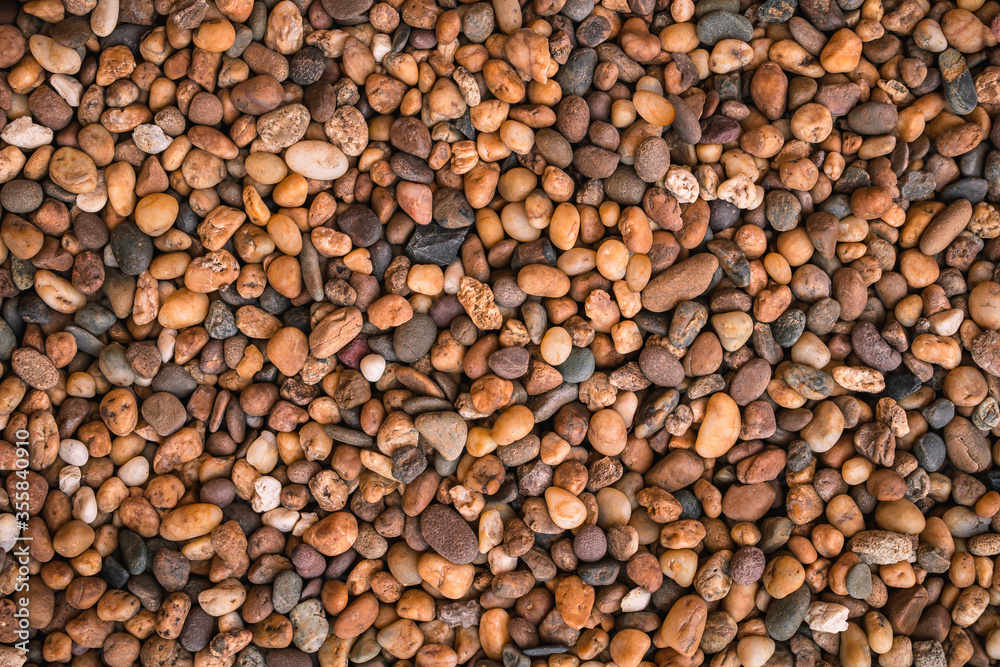Brown sea pebbles natural background, Small rock or stone texture floor in decorative a garden. Brown sea pebbles natural background, Small rock or stone texture floor in decorative a garden.