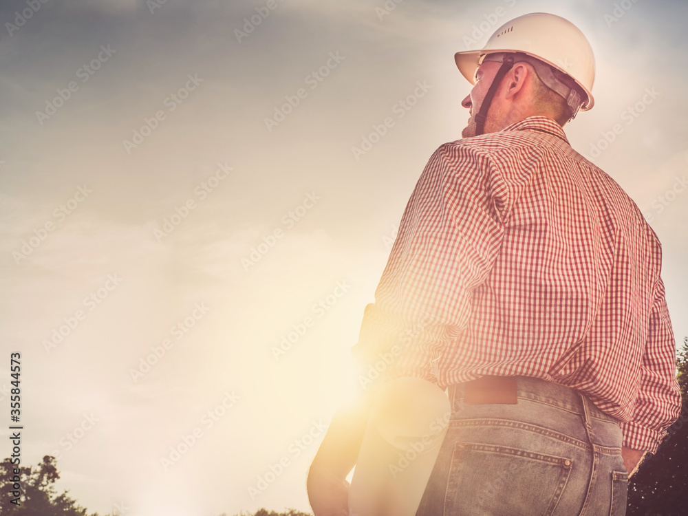 Young engineer in the park. Close-up. Concept of labor and employment Young engineer in the park. Close-up. Concept of labor and employment