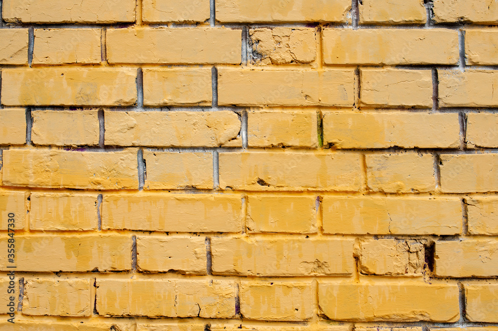 Obraz premium Texture background. The old yellow brick wall.