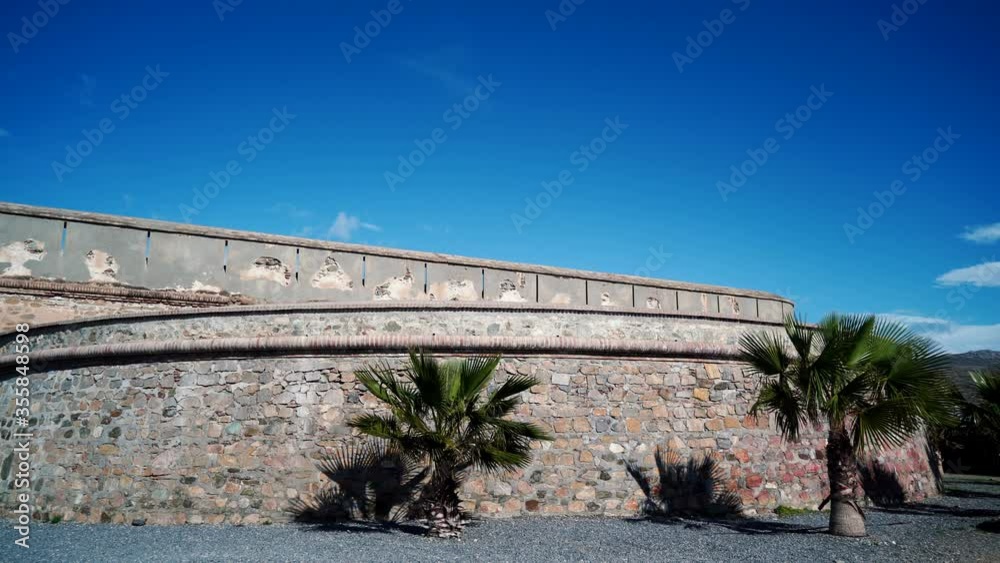 custom made wallpaper toronto digitalTime lapse of clouds over coastal fortification, castle Carchuna, Granada province, Andalusia Spain. Tourist attraction