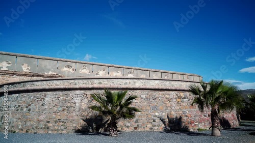 Wallpaper Mural Time lapse of clouds over coastal fortification, castle Carchuna, Granada province, Andalusia Spain. Tourist attraction
 Torontodigital.ca