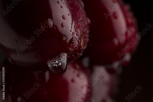 Background from sweet fresh wet red cherry, macro shot