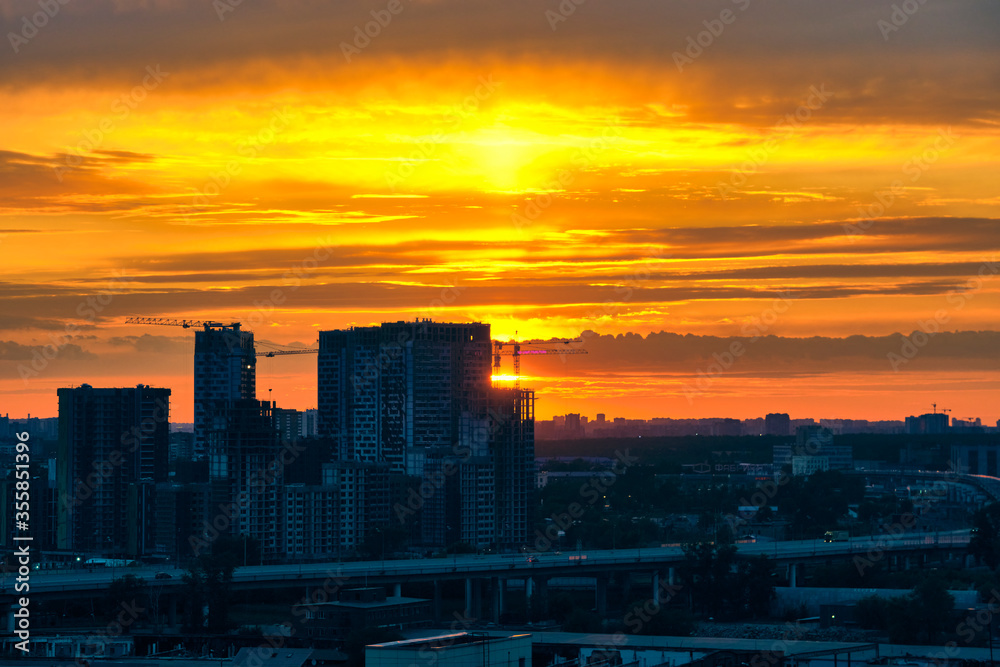 Obraz premium beautiful sunset over the silhouette of the east of Moscow color