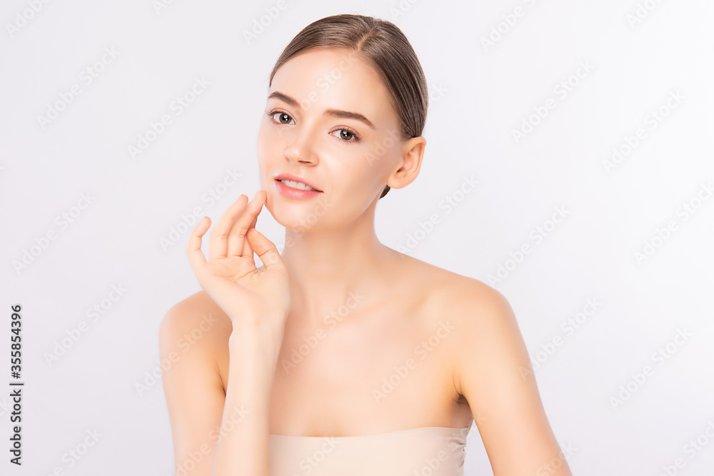 Beautiful Young Woman touching her clean face with fresh Healthy Skin, isolated on white background, Beauty Cosmetics and Facial treatment Concept Beautiful Young Woman touching her clean face with fresh Healthy Skin, isolated on white background, Beauty Cosmetics and Facial treatment Concept