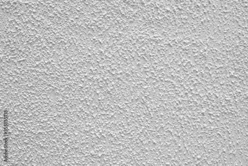 Gray rough plaster. Abstract building background. Surface of wall of building.