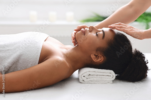 Facial spa massage for young african lady