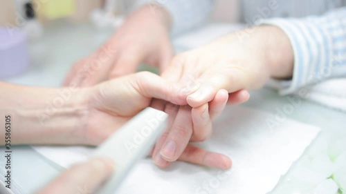 a manicurist saws a man's nails. High quality FullHD footage