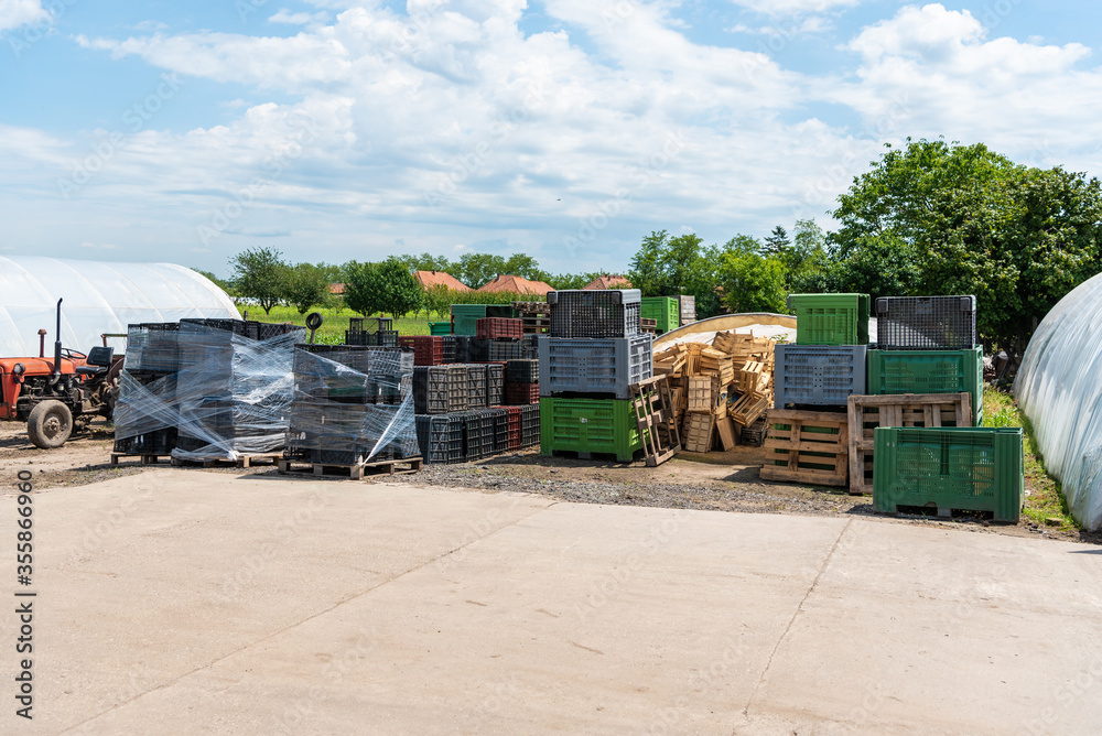 plastic and wooden crates ready for picking fruits and vegetables