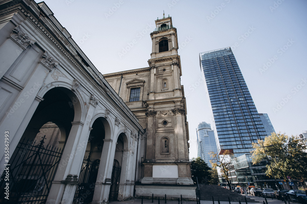 Ancient church in Poland, among skyscrapers