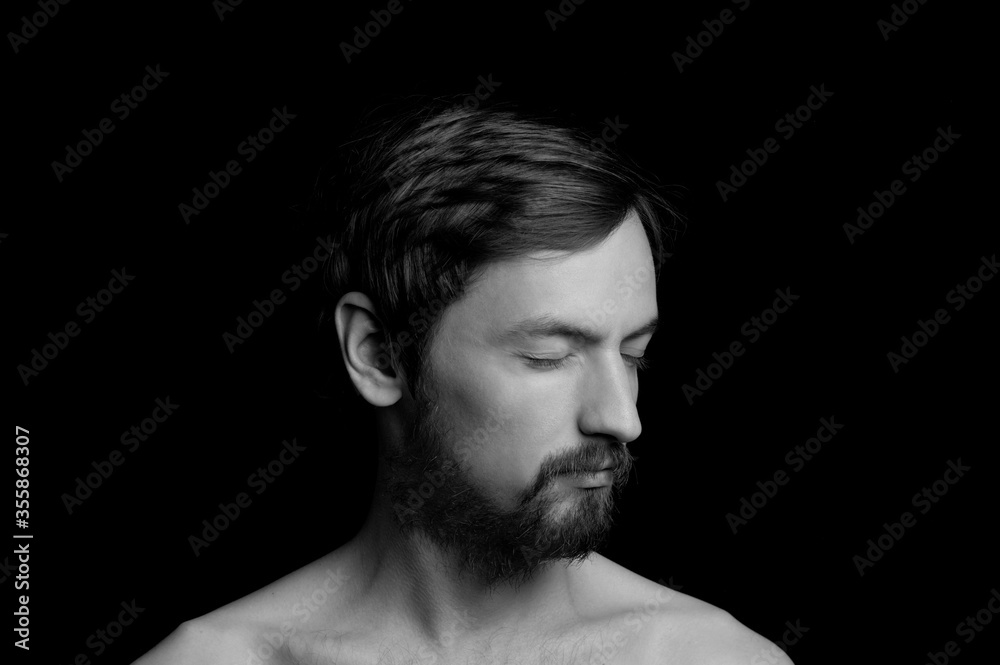 portrait of a guy with a beard on a black background portrait of a guy with a beard on a black background
