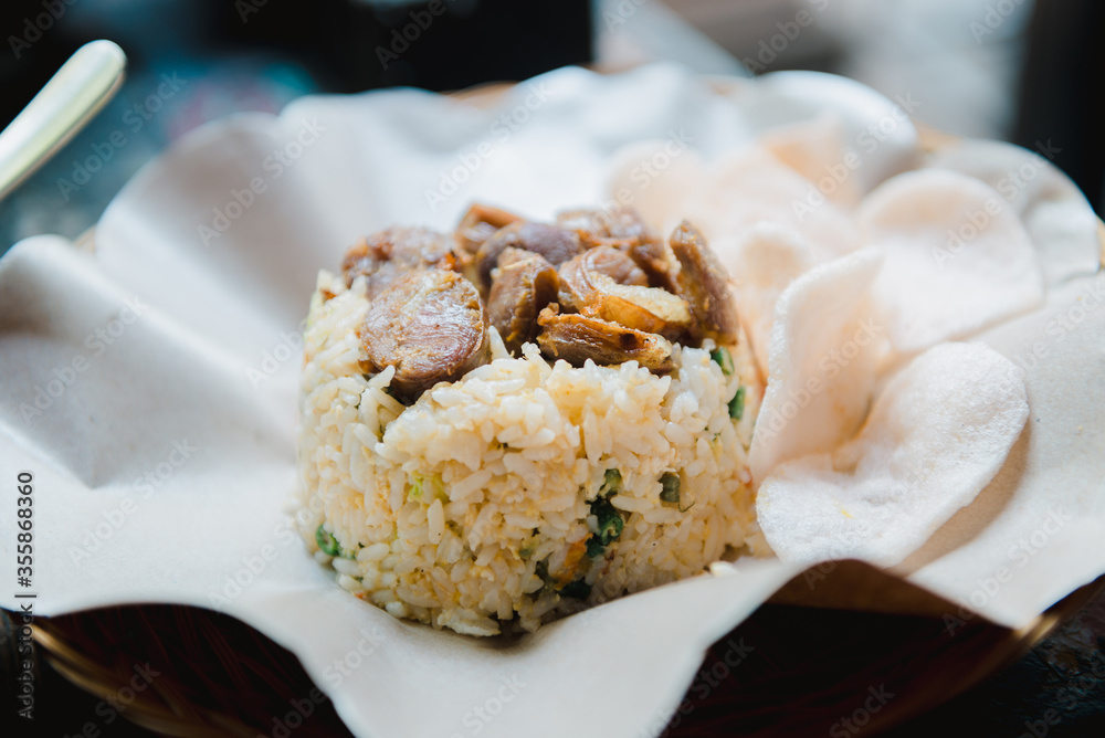 Indonesian fried rice with homemade sausage and crispy chips, nasi goreng