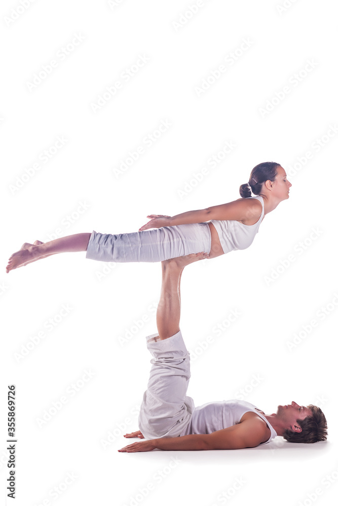 Naklejka premium Couple practicing acro yoga