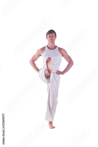 Man practicing yoga. © ivanvess