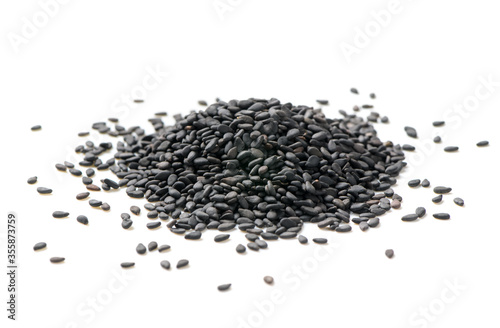 Black sesame seeds isolated on white background.