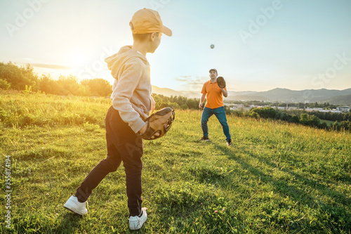 Photography Father and son playing in baseball
