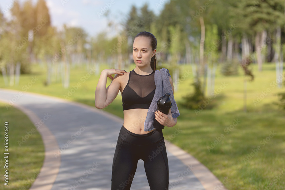 portrait of a beautiful woman goes in for sports in the park. portrait of a beautiful woman goes in for sports in the park.