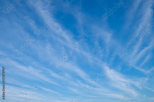 White streak clouds in the blue sky.