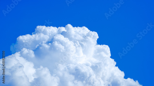 The blue sky and clouds gather on a bright day.