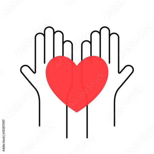 Charity, volunteering and donating concept. Raised up human hands with red heart. Children's hands are holding heart symbols. Charity and donating logo