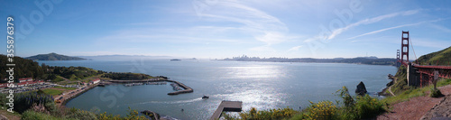 Panorama of San Francisco bay, Alcatraz Island, Golden Gate Bridge,  and city skyline.