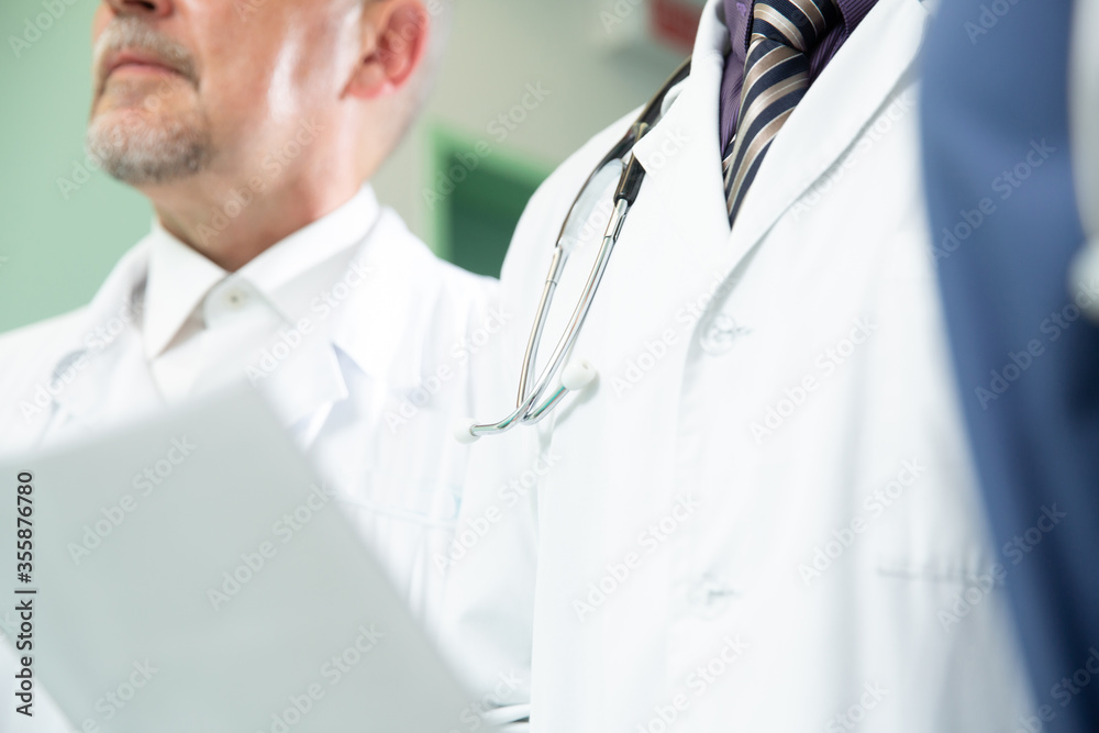 Team of Professional Surgeons and Nurses Suture Wound after Successful Surgery. Team of Professional Surgeons and Nurses Suture Wound after Successful Surgery.