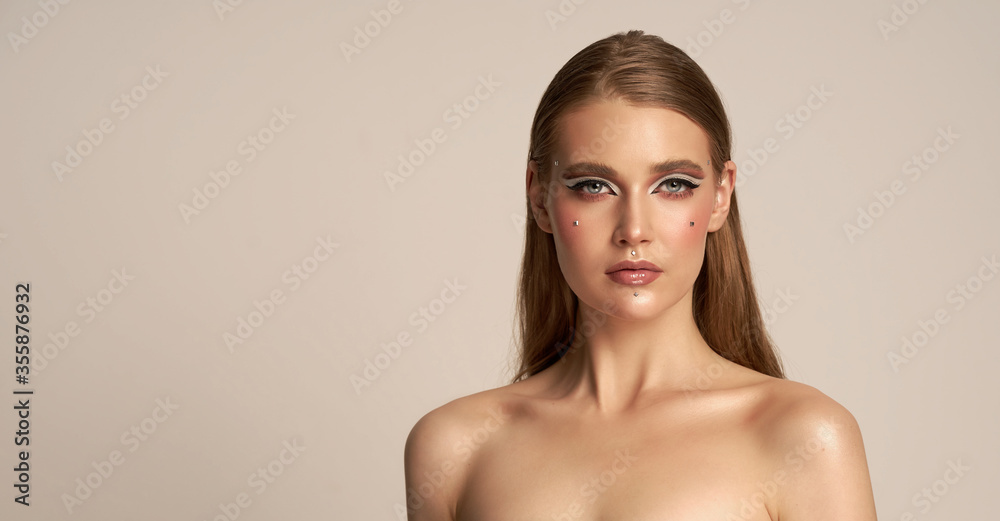The beautiful face of a young woman with clean fresh skin is closely isolated on white. concept of care for young people and skin The beautiful face of a young woman with clean fresh skin is closely isolated on white. concept of care for young people and skin