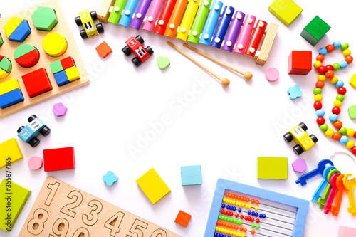 Colorful kids toys on white background. Top view, flat lay.