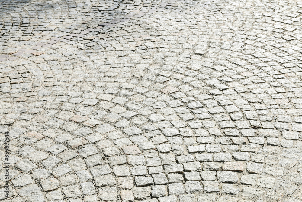Cobbled street in european city, background.