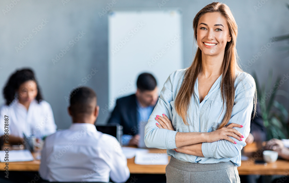 Successful Businesswoman Posing Standing In Modern Office During Meeting Successful Businesswoman Posing Standing In Modern Office During Meeting