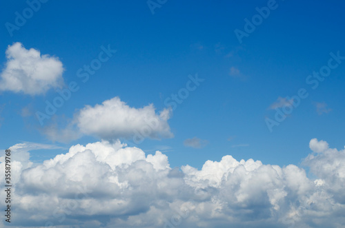 The background of the clouds spreading in the blue sky during the rainy season