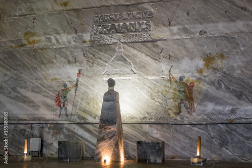 The  head of Emperor Trajan is carved from salt on a pedestal and wall drawings in salt mines in Slanic - Salina Slanic Prahova -  in the town of Prahova in Romania. photo