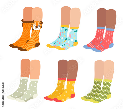 Socks on woman legs vector illustration set. Cartoon flat collection of girl underwear accessories, sock pair with colorful ornament, print and pattern, funny warm socks footwear isolated on white