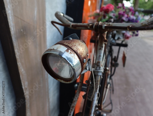 Rusty vintage bicycle lamp selective focus images of the headlamp of the classic bicycle