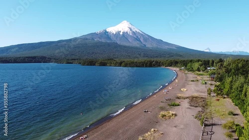 Aerial drone view of volcanic lake called Llanquihue Lake with people on a beach near Osorno Volcano in Chilean Andes. One of most active volcano in Chile simialar to Mount Fuji.
Chile.