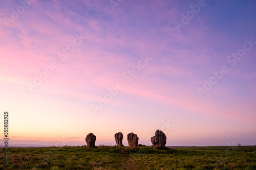 Duddo Stone Circle - Northumberland at sunset with purple sky photo
