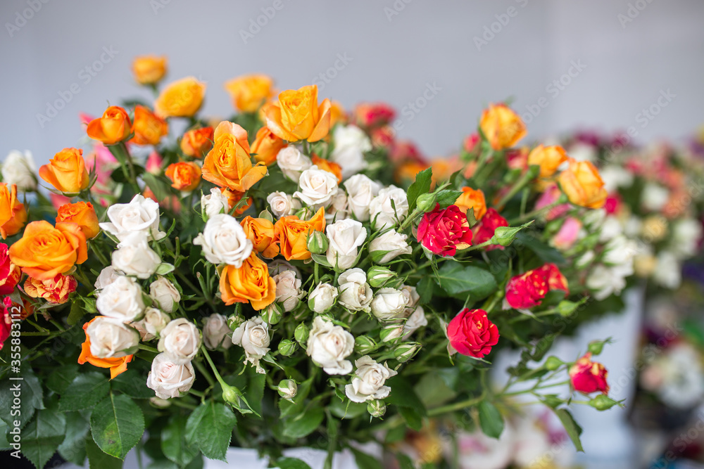 a large bouquet of roses. white, orange and red flowers. gift for a girl a large bouquet of roses. white, orange and red flowers. gift for a girl