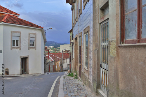 A small, Portuguese street with old houses. Colorful landscape of a European residential street.