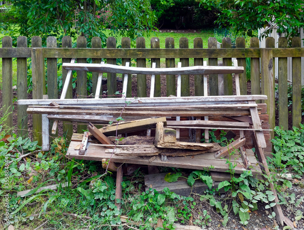 Discarded broken scrap pile of furniture in alley. Discarded broken scrap pile of furniture in alley.