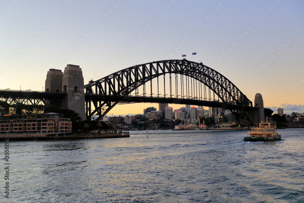 Sydney, Australia - July 17, 2014; Sunrise and sydney harbor bridge view on a beautiful day.
