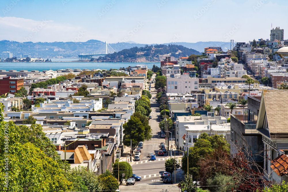 View towards San Francisco Bay, Russian Hill and North Beach of San Francisco from Russian Hill showing the hilly terrain in a sunny day