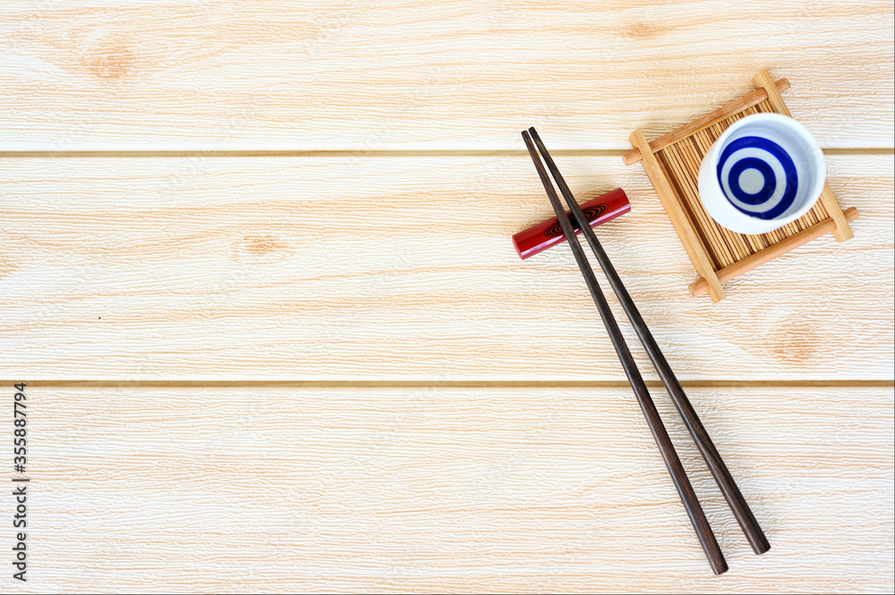 wood chopsticks on wood table background copy space.