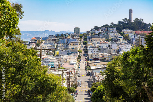 View towards San Francisco Bay, Russian Hill and North Beach of San Francisco from high point showing hilly terrain and Colt Tower in the 